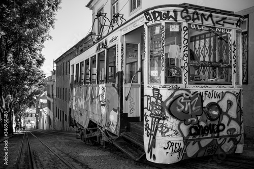 black and white photo of lisbons famous yellow tram photo