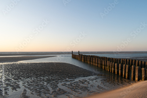 sunset at the beach, blue hour, breakwaters