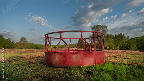 Tablou pe pânză Cattle round bale feeder on a spring day, no hay or cows