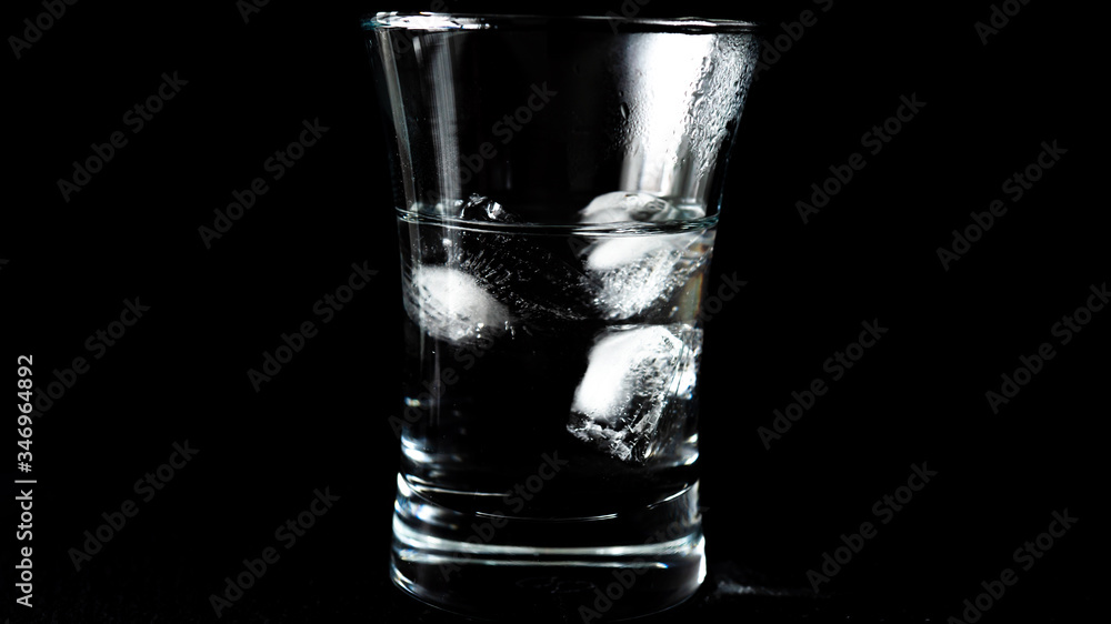 Close-up of melting ice cubes on black background Close-up of melting ice cubes on black background