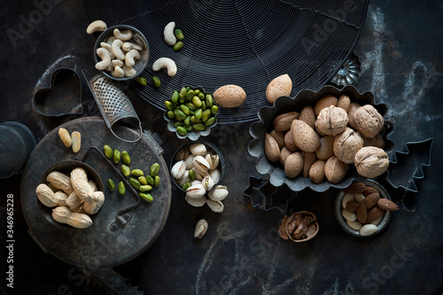 Tray and bowls of various nuts photo