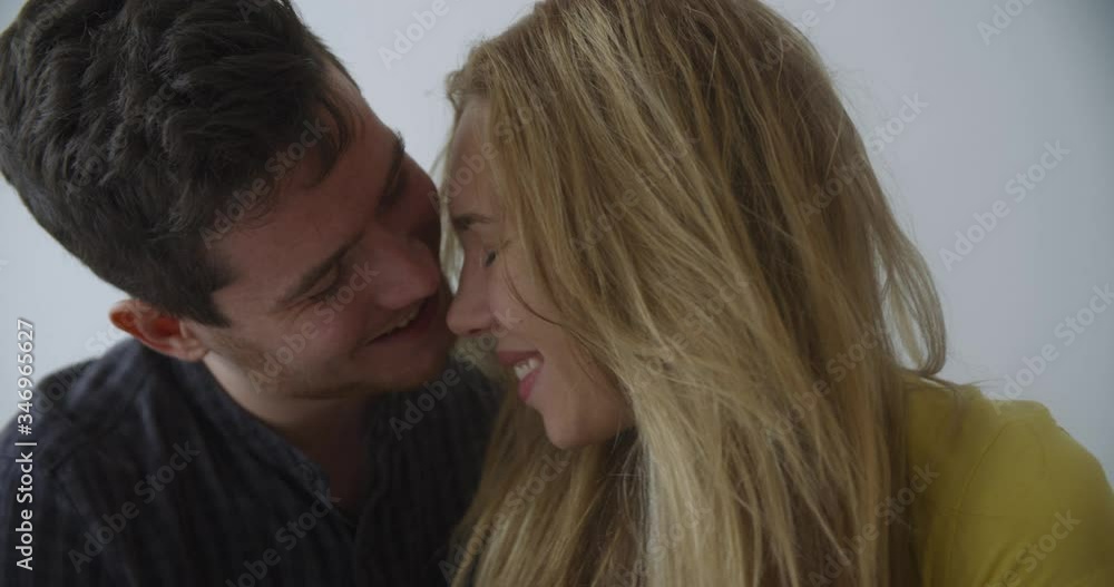 happy couple first kiss. girl kissing boyfriend at home after romantic evening date together 4k happy couple first kiss. girl kissing boyfriend at home after romantic evening date together 4k