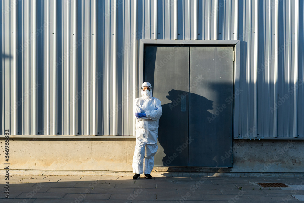 Female scientist wearing protective suit and mask Female scientist wearing protective suit and mask