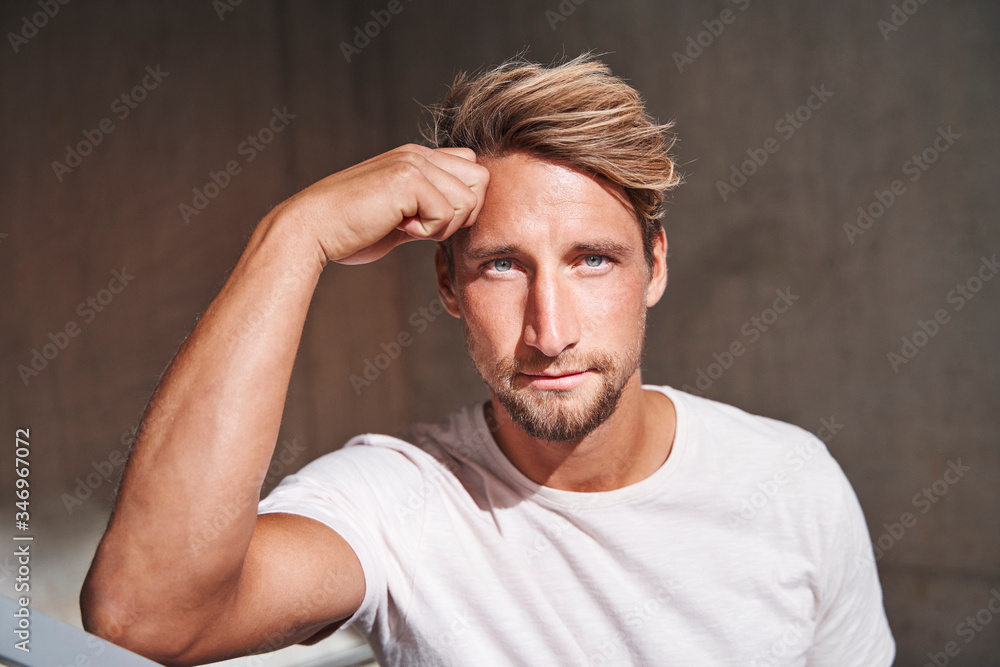 Portrait of attactive young man wearing white t-shirt Portrait of attactive young man wearing white t-shirt