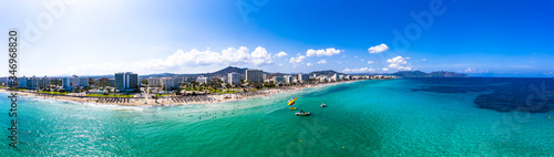 Spain, Balearic Islands,?Cala?Bona, Aerial panorama of coastline of resort town in summer photo