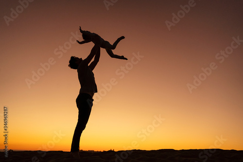 Wallpaper Mural Father playing with daughter on sand dune at sunset, Gran Canaria, Spain Torontodigital.ca