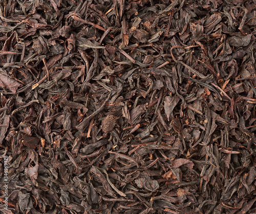 texture of dry black long leaf tea, top view