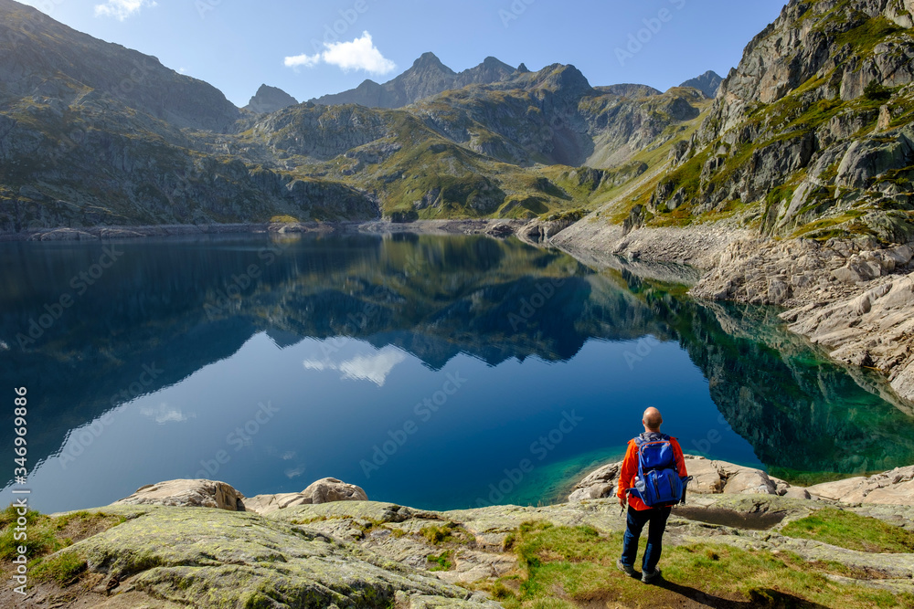 France, Pyrenees-Atlantiques, Laruns, Lone hiker at Lac?dArtouste?in?Ossau?Valley France, Pyrenees-Atlantiques, Laruns, Lone hiker at Lac?dArtouste?in?Ossau?Valley