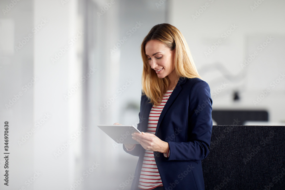 Businesswoman using tablet in office Businesswoman using tablet in office