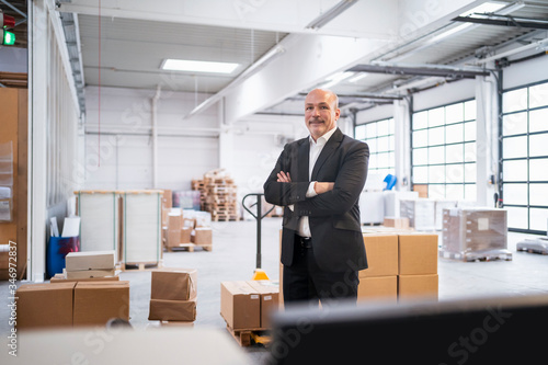 Wallpaper Mural Portrait of a confident businessman in a factory Torontodigital.ca