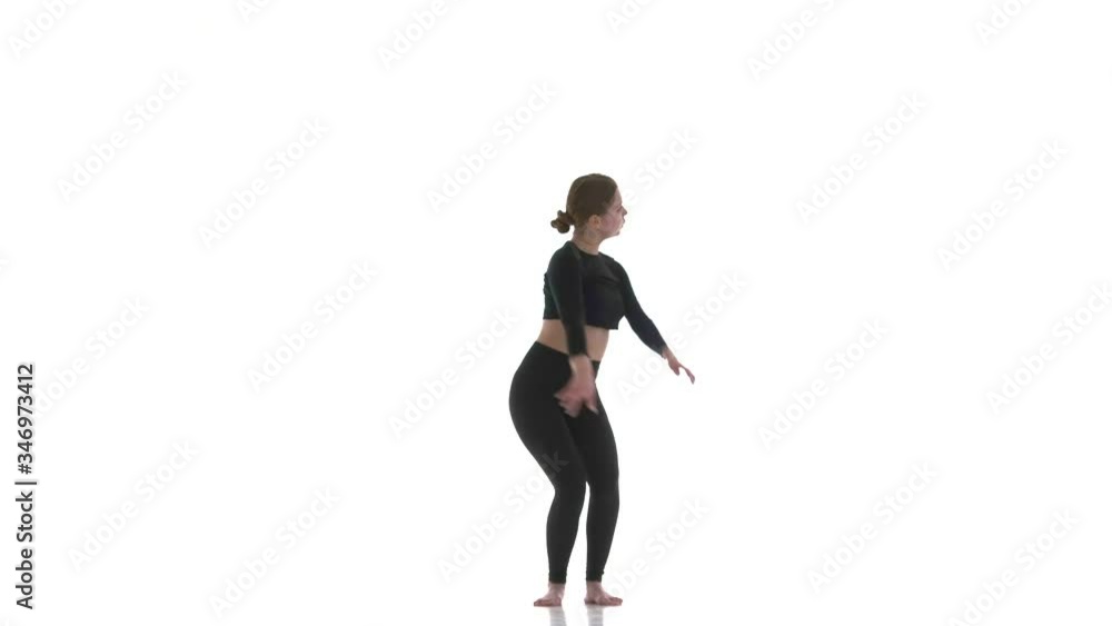 young beautiful girl dancer in black short top and black leggings dancing contemporary, modern ballet dance, isolated, slow motion young beautiful girl dancer in black short top and black leggings dancing contemporary, modern ballet dance, isolated, slow motion