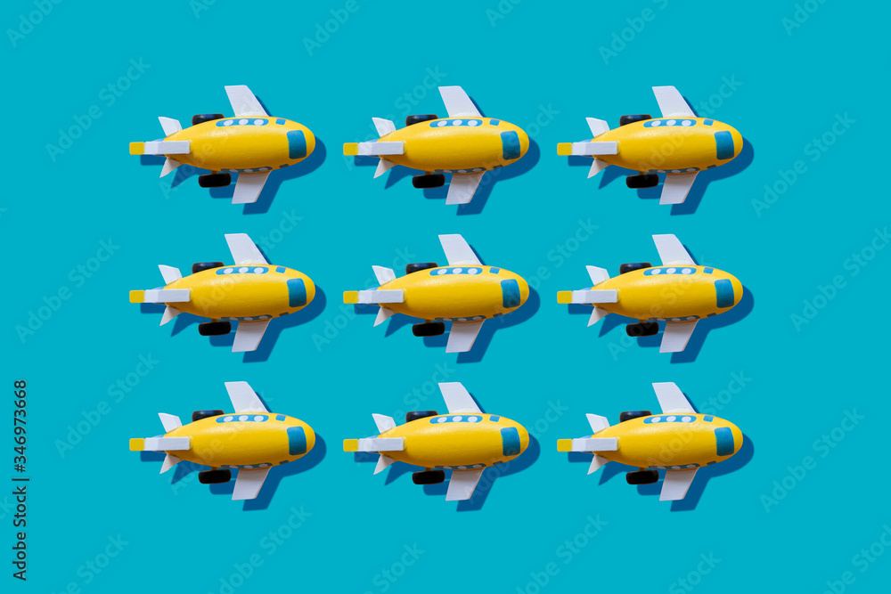 Yellow planes in a row on blue background Yellow planes in a row on blue background