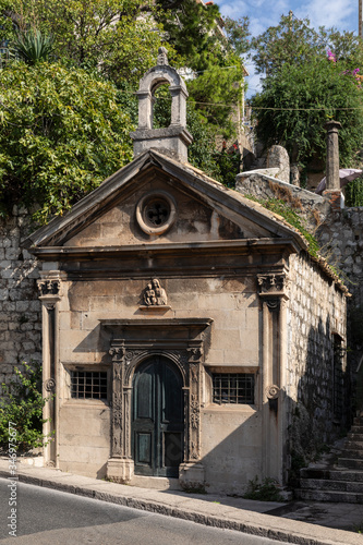 A small chapel near the old town of Dubrovnik, Dalmatia, Croatia. The historical mediterranean church is a monument which is situated near Pile and has a rosette detail. Travel destination in Europe