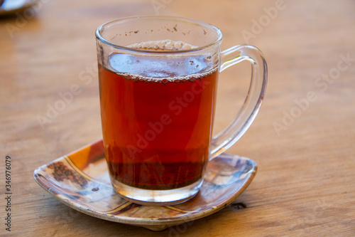 Glass of a traditional egyptian black tea served in the restaurant in St Catherine,Egypt. 
