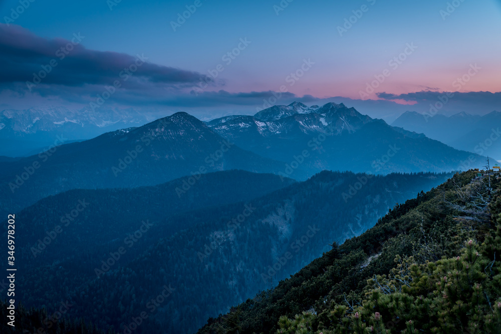 Mountain panorama of the Alps under a full moon