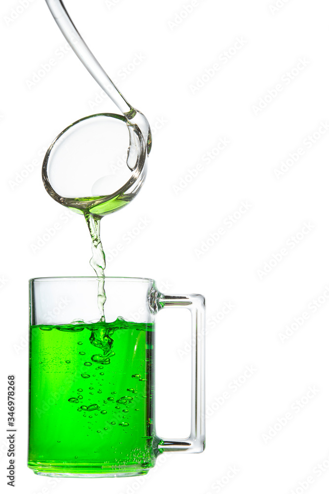 Glass mug and ladle with tarragon drink Glass mug and ladle with tarragon drink