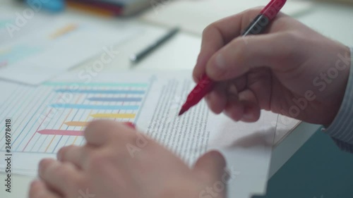 Office worker marks errors in the document