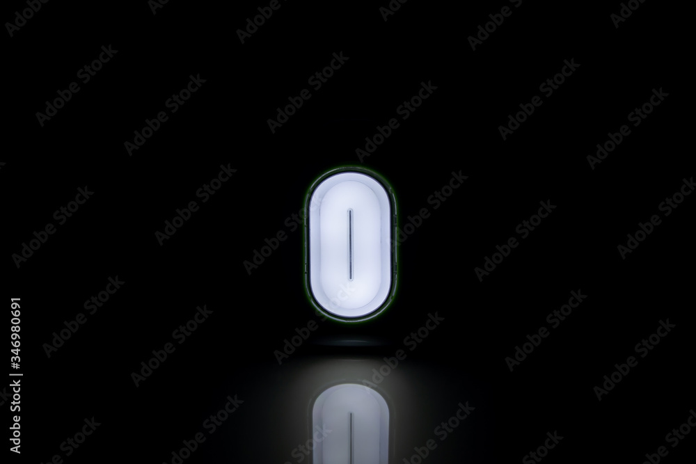 The digit zero shines on a black background, forming an abstract background The digit zero shines on a black background, forming an abstract background
