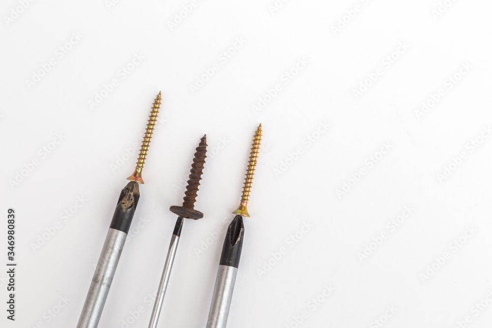 Fototapeta premium screwdrivers with screws on a white background