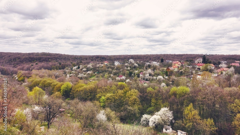 Top view of the forest, gardens and village in spring Top view of the forest, gardens and village in spring