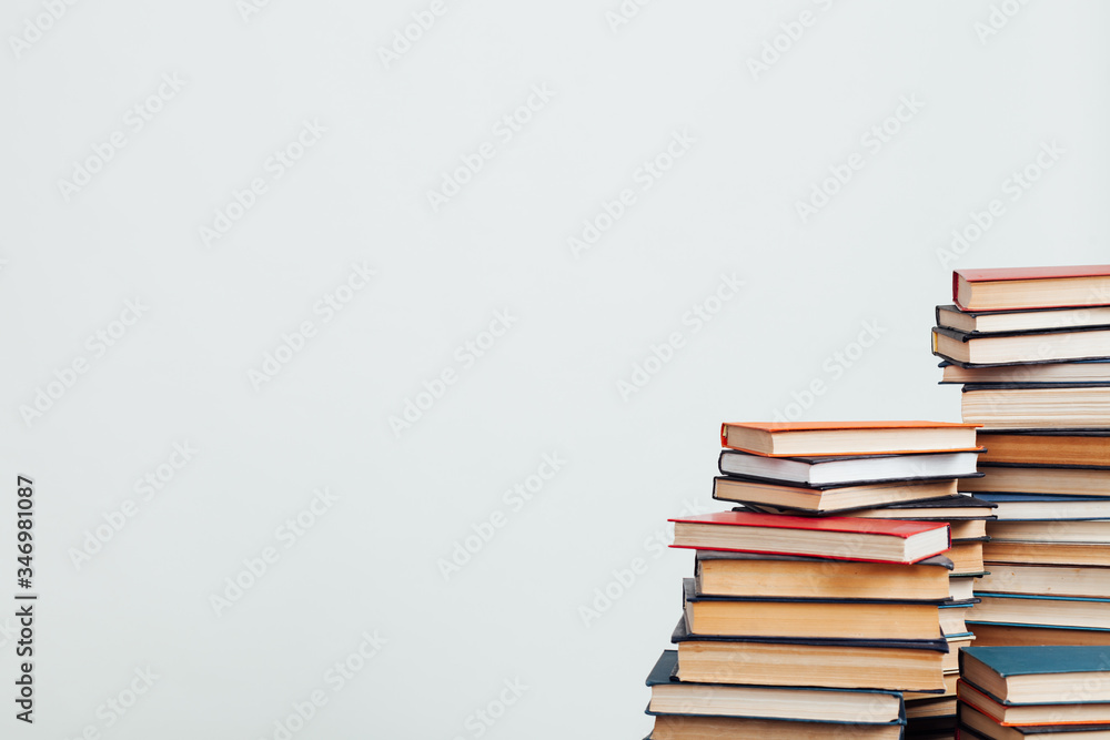 a lot of educational books for exams at the university on the white background of the library a lot of educational books for exams at the university on the white background of the library