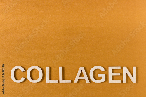 Collagen word written with wooden letters, top view