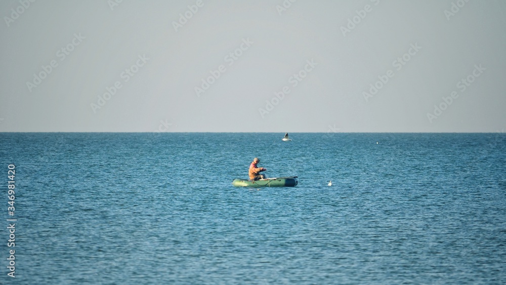 Fisherman on a boat at sea