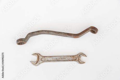 Old used ring spanner and Wrench on a white background 