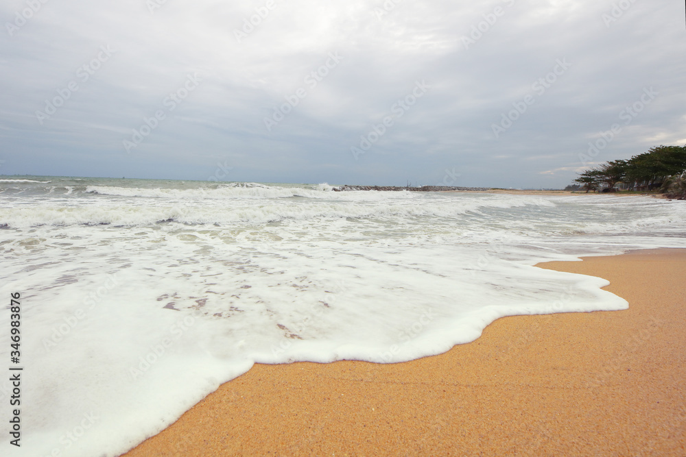Sand beach with Bubule and water foarm from wave of sea Sand beach with Bubule and water foarm from wave of sea