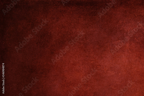 Abstract red stained paper texture background or backdrop. Empty old red paperboard or grainy cardboard for decorative design element. Simple monochrome surface for journal template presentation.