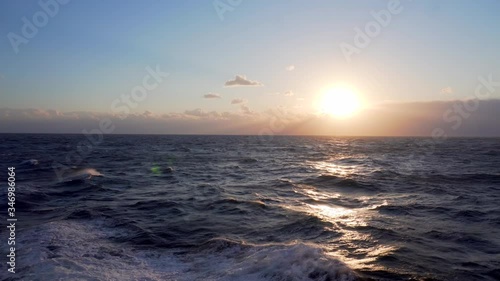 Beautiful sea sunset. Small waves on the high seas during a beautiful sunset. Rema for relaxation.