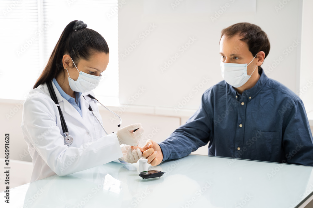 Doctor In Face Mask Checking Blood Glucose Doctor In Face Mask Checking Blood Glucose