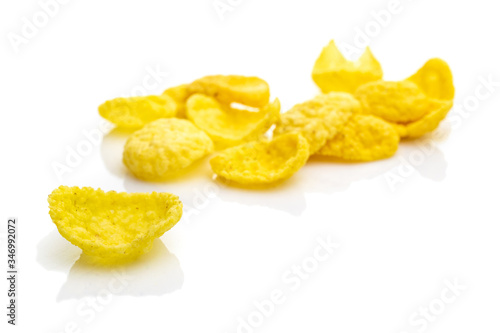 Isolated corn flakes on white. Snack Cereal yellow Healthy Cornflakes - Superfood background. Vegan gluten-free organic, healthy diet vegetarian superfood with antioxidant, mineral nutrients.