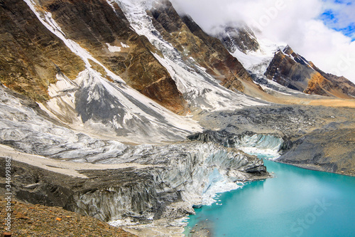Glacier melting in Tilicho Lake on Annapruna Circuit Trek, Nepal photo