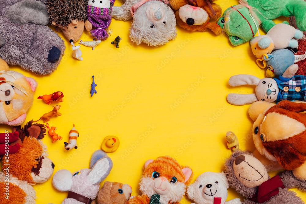 Lots of children's toys for child development games on a yellow background