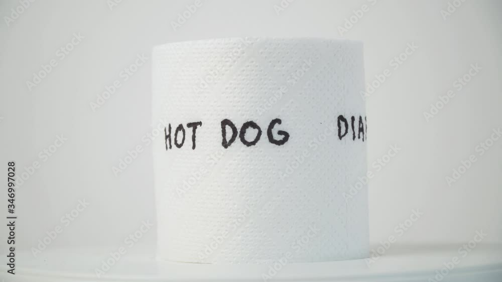Toilet paper with text hot dog and diarrhea. Concept of personal hygiene. Fast food Concept Toilet paper with text hot dog and diarrhea. Concept of personal hygiene. Fast food Concept