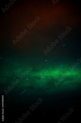 slight aurora with clear stars in different colour 