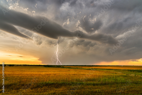 storm clouds and lightning over a Texas field
