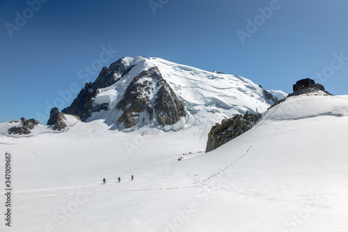 Mont Blanc three mounts route (par les 3 monts) over Mont-blanc du Tacul, Mont Maudit and the main Alps mount Mont-Blanc. View from Aiguille du Midi Chamonix France