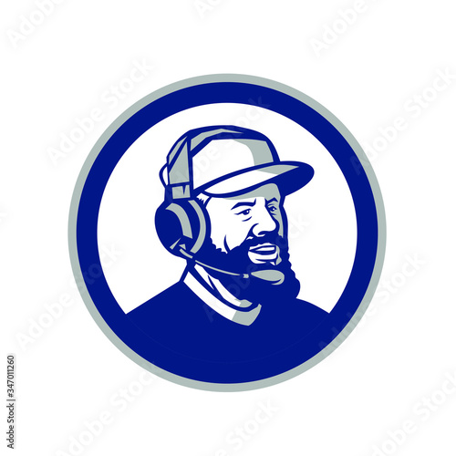 Mascot icon illustration of head of a coach with beard, baseball cap and wearing headphones or headset looking forward to side set inside circle on isolated white background in retro style.