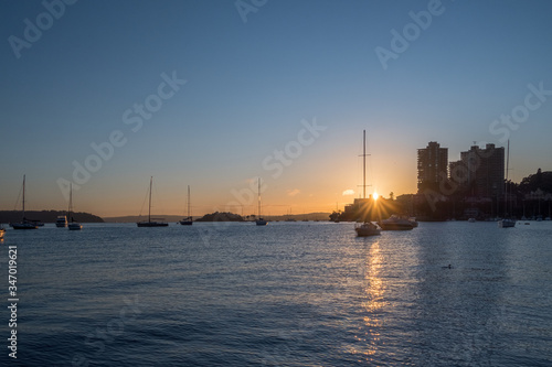 sunrise and yachts on the bay