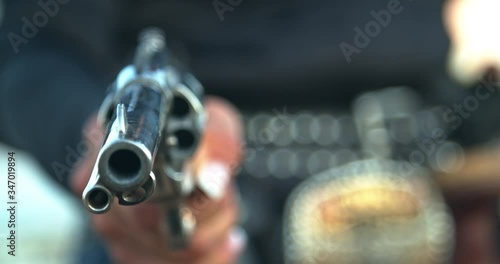 Cowgirl Aiming a Pistol