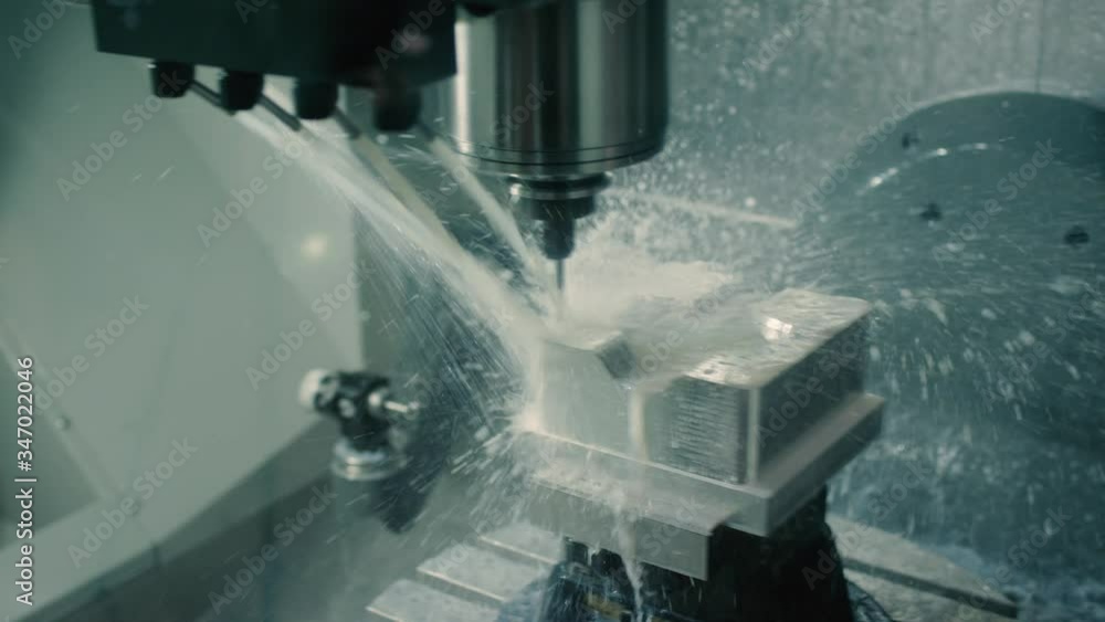 Mold machine drills and sprays water on mold as it's made in manufacturing plant Mold machine drills and sprays water on mold as it's made in manufacturing plant