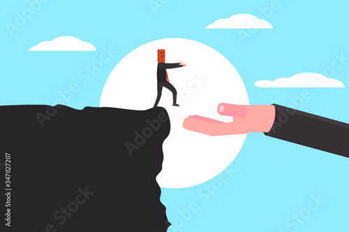 Clueless businessman walking on the edge of the cliff with paper bag on his head saved by another businessman's hand