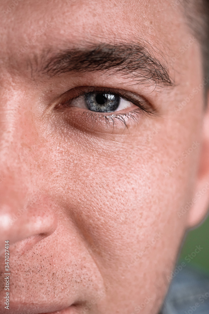 the eye. close-up. the guy is watching. long eyelashes the eye. close-up. the guy is watching. long eyelashes