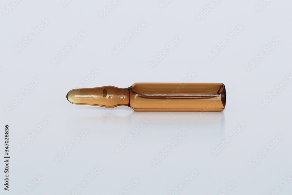 Isolated brown vaccine vial in horzontal direction Isolated brown vaccine vial in horzontal direction
