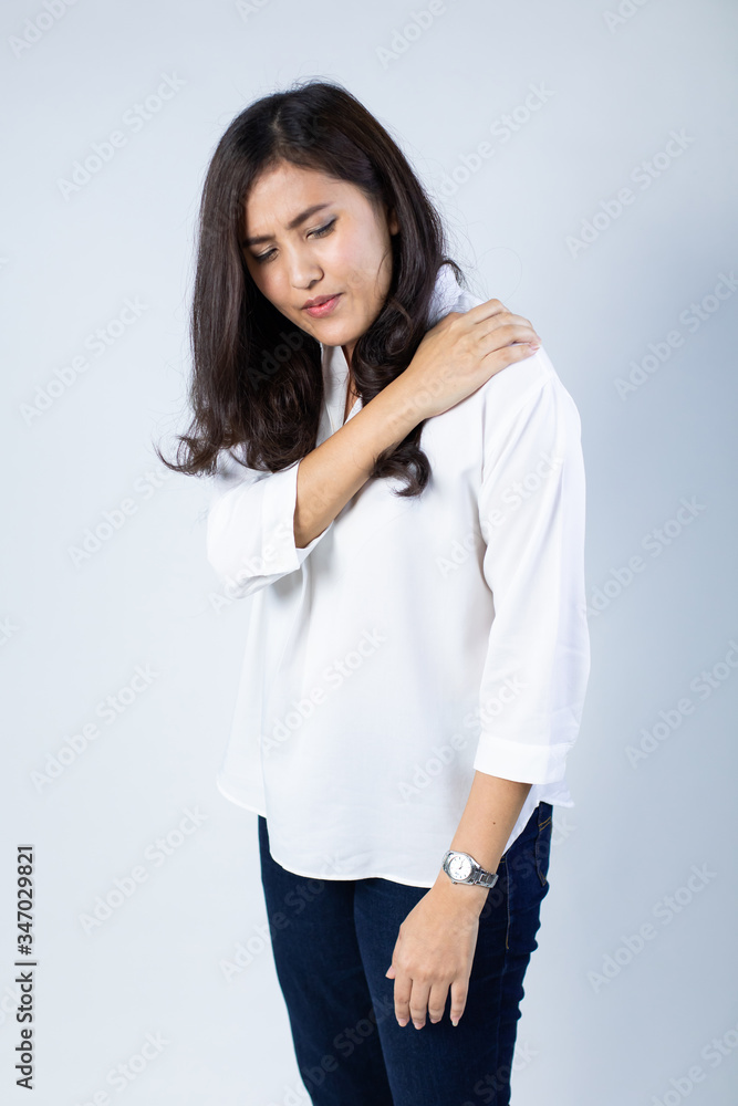 office syndrome concept. health care concept. Young beautiful asian woman feeling hurt with shoulder pain or stiffness. office syndrome concept. health care concept. Young beautiful asian woman feeling hurt with shoulder pain or stiffness.
