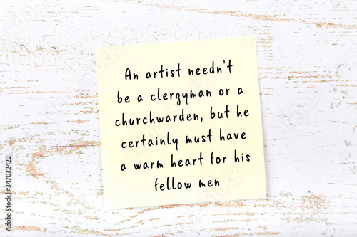 Yellow sticky note with handwritten motivational quote photo