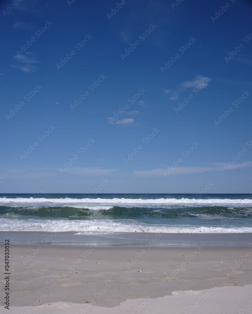 Nearly empty beaches on Island Beach state park in New Jersey the day the beaches opened during the covid-19 pandemic