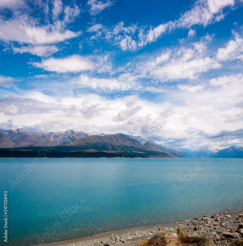 Vertical panorama at Lake Pukaki, a glacial alpine lake in Mackenzie Basin in New Zealand's South Island, famous for its distinctly milky blue color.